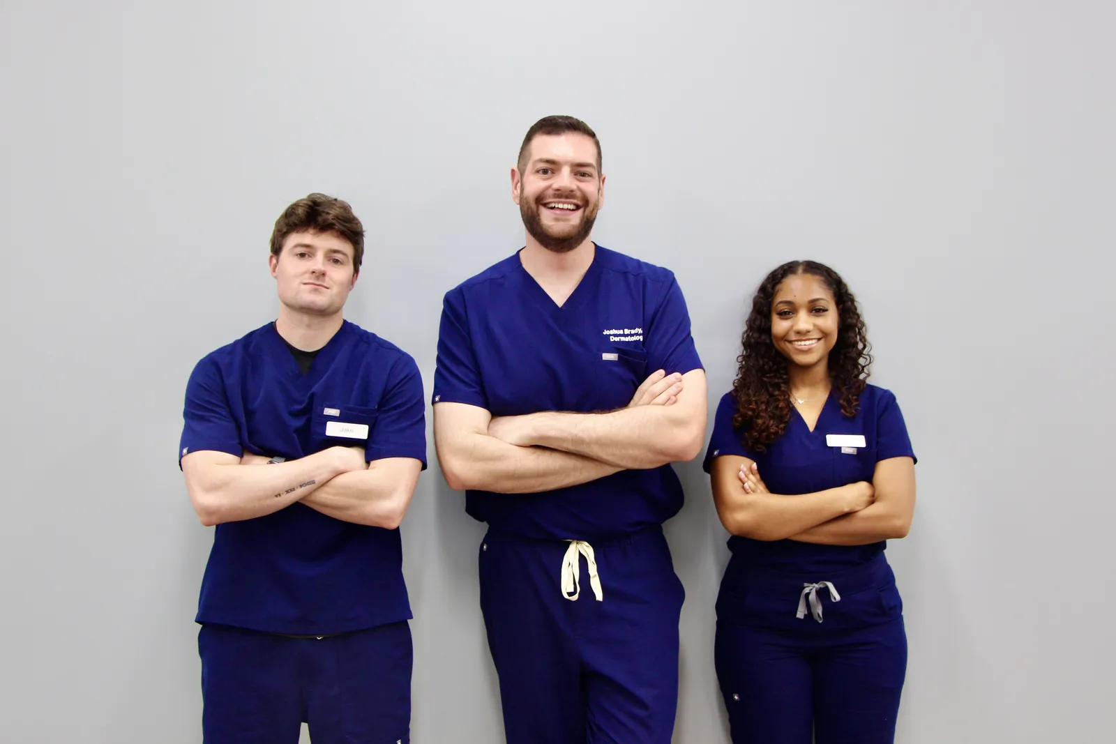 Dr. Joshua Brady with two members of the Tampa Bay Dermatology team
